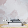 Pink abstract watercolor wallpaper in a bright modern living room setting, creating a peaceful atmosphere