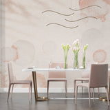 Modern circular wallpaper adding warmth to a dining room