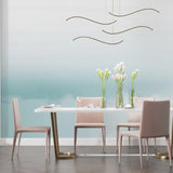 Aqua gradient wave wallpaper creating a serene atmosphere in a modern living room