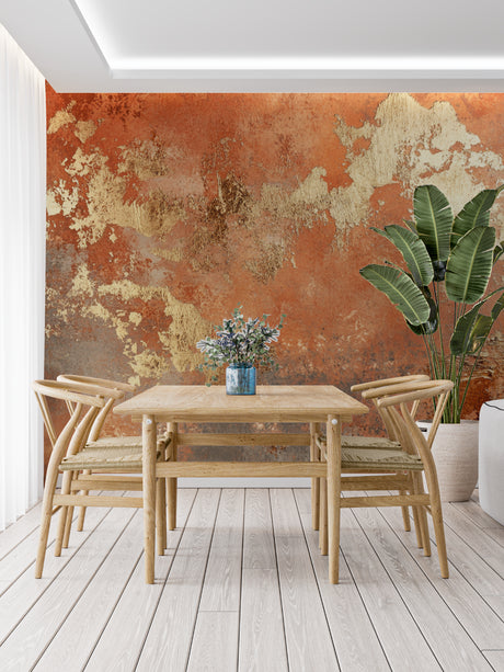 Abstract gold metallic wallpaper creating a warm ambiance in a modern living room with natural light