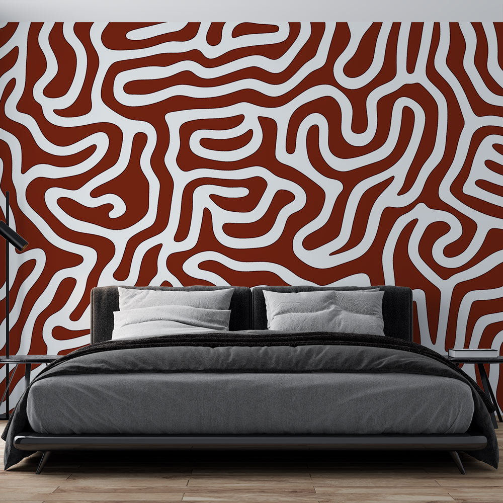 Modern geometric abstract wallpaper in terracotta tones creating a stunning focal point in a minimalist living room