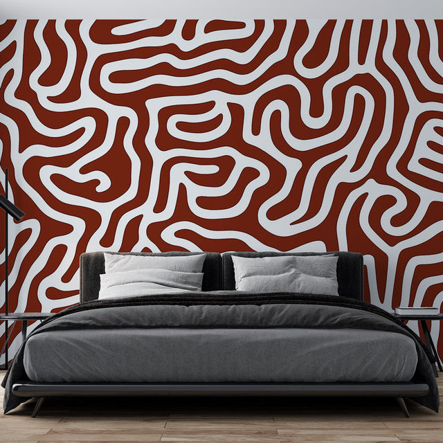 Modern geometric abstract wallpaper in terracotta tones creating a stunning focal point in a minimalist living room