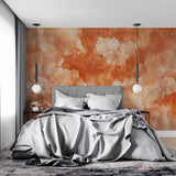 Home office with abstract watercolor wall mural in warm terracotta shades