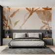 Abstract terracotta and gold wallpaper mural in modern living room with natural light