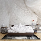 Dining room with modern wave pattern wallpaper creating elegant ambient lighting effects