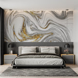White marble wallpaper with gold swirls featured in master bedroom, adding luxury to neutral decor