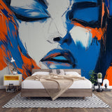 Abstract portrait wallpaper creating dramatic impact in modern office space, blue and orange tones complementing contemporary furniture