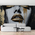 Abstract portrait wallpaper in gold and black creating drama in a modern living room with high ceilings