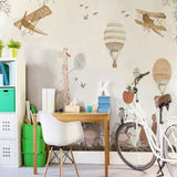 Kids playroom featuring safari adventure wallpaper with flying animals and vintage airplanes