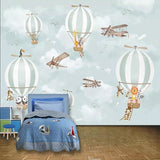 Kids room with sky journey wallpaper showing floating animals and balloons