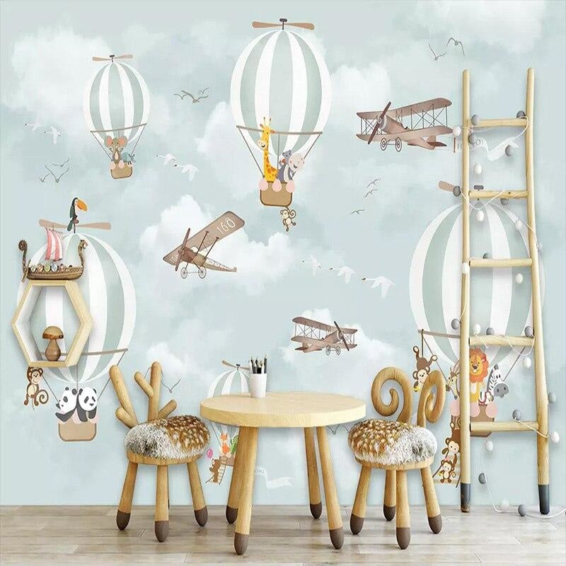 Baby room featuring sky adventure wallpaper with floating safari animals