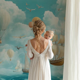 Playroom wall with adventure mural showing sailing ships and balloons in action