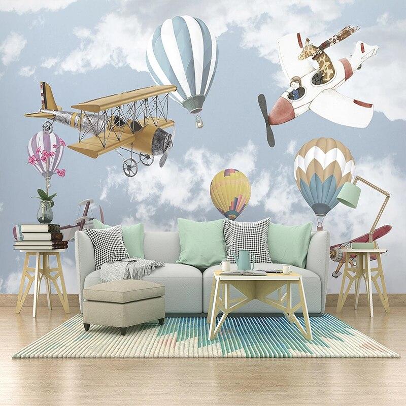 Kids playroom with vintage airplane wallpaper, featuring pastel hot air balloons and biplanes
