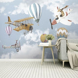 Baby room with aviation adventure wallpaper showing gentle sky scenes and whimsical aircraft