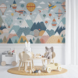 Hot air balloon wallpaper mural creating depth in a playroom with reading nook