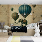 Hot air balloon and elephant wallpaper creating a magical atmosphere in a bright nursery with vintage-style furniture