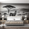 Black and white African savanna wallpaper creating depth in a modern living room with clean lines and natural light
