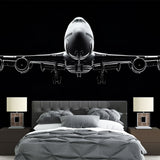 Modern Airplane Wallpaper displayed in a minimalist office space, showing black and white aviation design