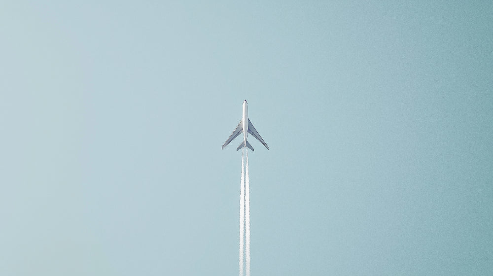 Minimalist airplane wallpaper design file showing clean lines and powder-blue sky pattern