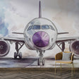 Modern Airplane Wallpaper displayed in a bright home office, showing purple and silver watercolor aircraft design