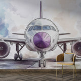 Modern Airplane Wallpaper displayed in a bright home office, showing purple and silver watercolor aircraft design