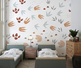 Animal tracks wallpaper creating a cozy atmosphere in a modern nursery with soft natural lighting