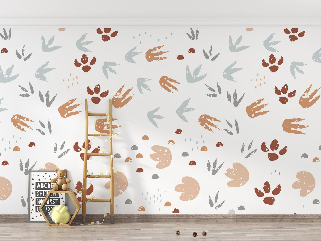 Nature-inspired wall mural with animal tracks featured in a child's reading nook