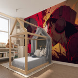 Gaming room with anime mural wallpaper showing stunning red and black design in evening lighting
