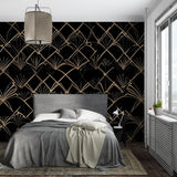 Art deco geometric wallpaper in modern living room, black and gold pattern creating dramatic accent wall
