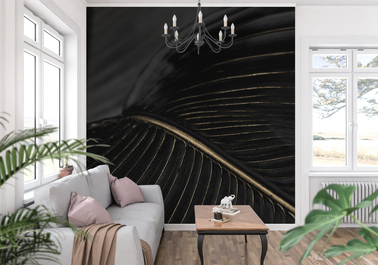Black and gold art deco wallpaper creating drama in a modern living room setting