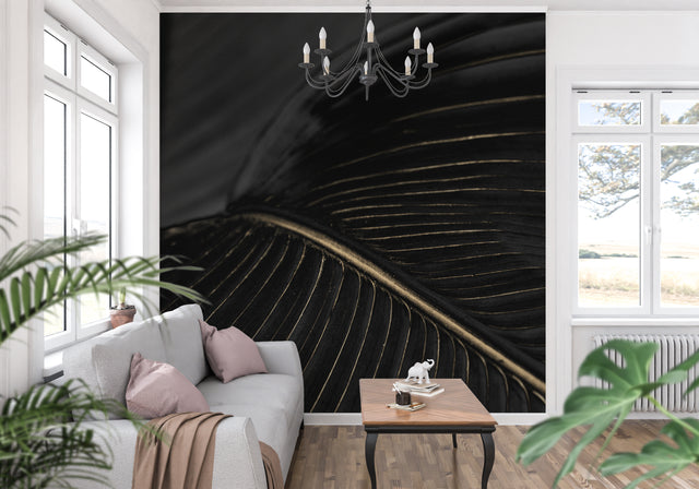 Black and gold art deco wallpaper creating drama in a modern living room setting