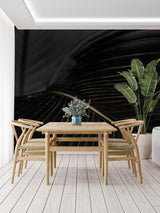 Art deco leaf pattern mural adding luxury to a dining room with pendant lights