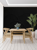 Black circular pattern wall mural in master bedroom setting