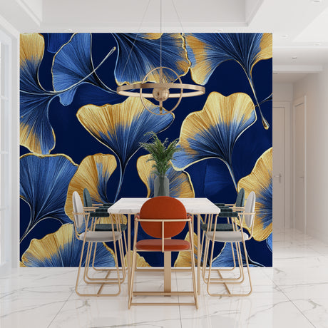 Blue and gold Art Deco wallpaper with ginkgo leaves creating drama in a modern dining room setting