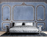 Classic panel wall mural creating depth in a modern living room with minimal furniture