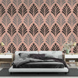 Art deco pink and black fan pattern wallpaper in a modern dining room with crystal chandelier and velvet chairs
