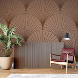 Art deco wallpaper featuring fan motifs in a home office with brass desk accessories