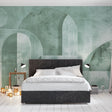 Art deco geometric wallpaper in green tones creating an elegant backdrop in a modern living room with minimal furniture
