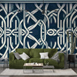 Art deco geometric wallpaper in navy bringing modern elegance to a luxury dining room with crystal chandelier