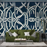 Art deco geometric wallpaper in navy bringing modern elegance to a luxury dining room with crystal chandelier
