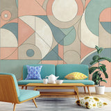 Modern Art Deco geometric wallpaper in a bright living room, showing pastel circles and curves creating a soft, sophisticated atmosphere