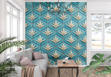 Geometric wallpaper in home office with brass desk and turquoise accessories