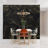 Black and gold Art Deco wallpaper creating statement wall in living room