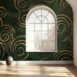 Art deco green and gold spiral wallpaper in modern dining room with crystal chandelier