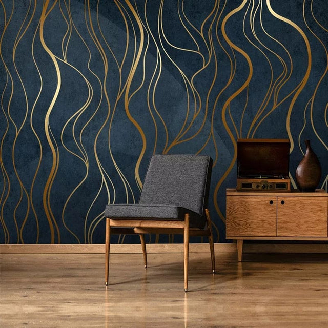 Art deco gold wave wallpaper in modern dining room with crystal chandelier and navy accents