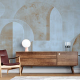 Modern Art Deco wallpaper with geometric arches creates an elegant statement wall in a bright, contemporary living room