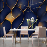 Navy blue and gold abstract wall mural creating drama in master bedroom with white bedding