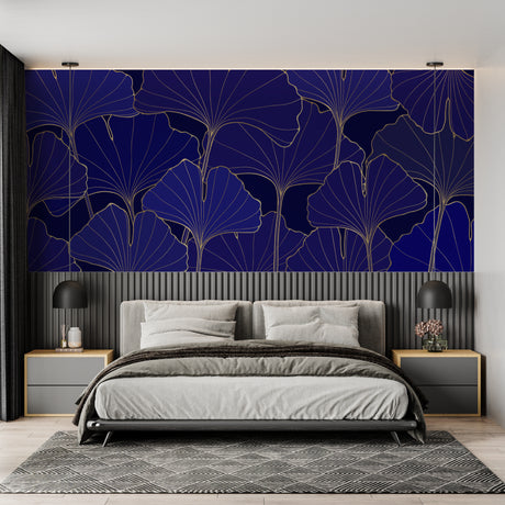 Navy and gold Art Deco wallpaper with ginkgo leaves pattern in modern living room creating elegant atmosphere