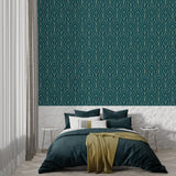 Teal and gold art deco wallpaper in master bedroom showing geometric pattern detail