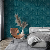 Home office space with teal geometric art deco wallpaper and minimalist desk setup